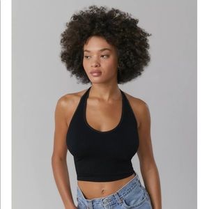 out from under ribbed halter crop top.
